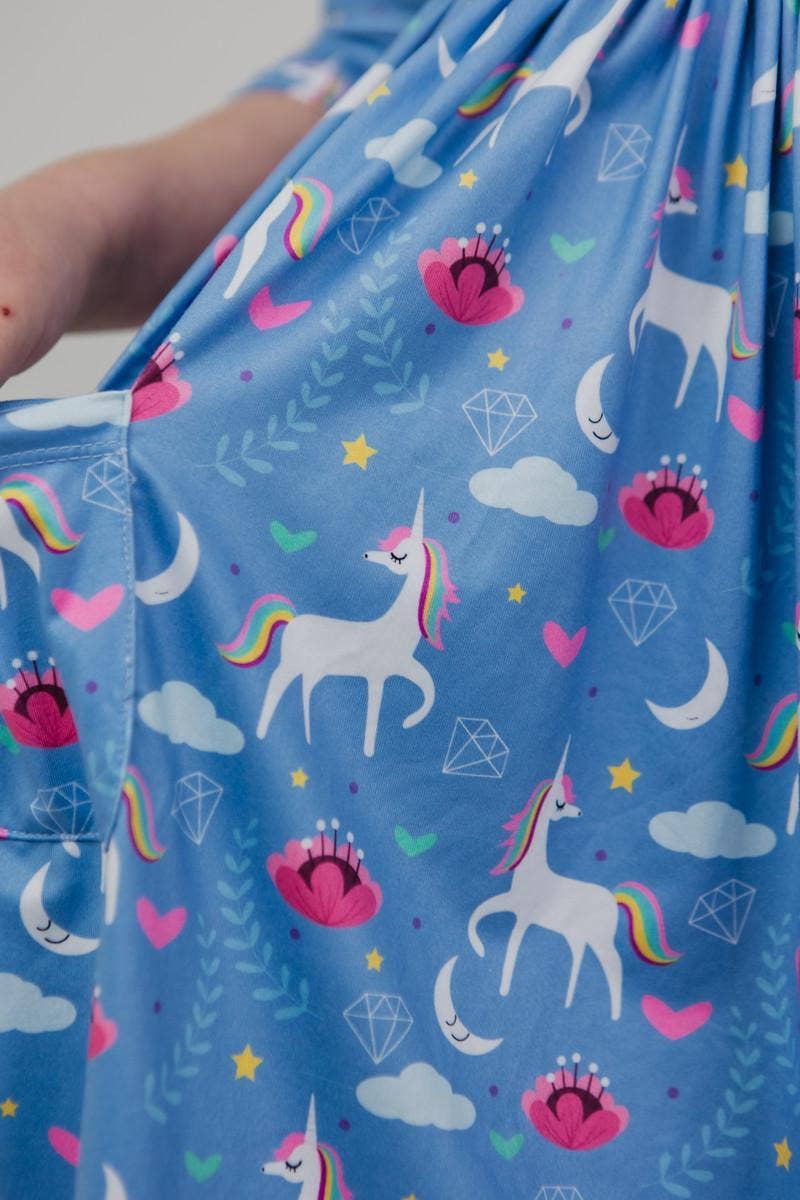 Blue fabric with unicorn and rainbow pattern
