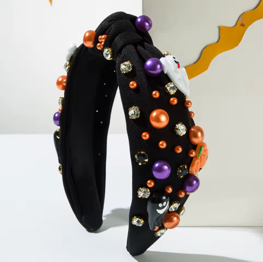 Black headband with Halloween-themed beads and decorations on a white background
